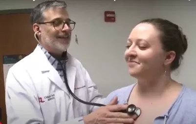 Doctor listening to a patients heartbeat